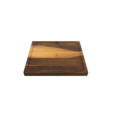 Load image into Gallery viewer, Medium sized handmade cutting board, in walnut, hand finished, with a carved, recessed face feature for juicy foods. Made in the USA.