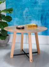 Load image into Gallery viewer, Modern round dining table. Handmade in the us. With a tapered pedestal legs with blackened steel supports.