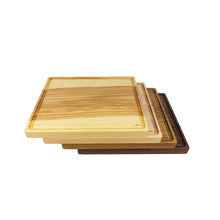 Load image into Gallery viewer, Set of stacked, handmade cutting boards on display, varying in wood species.
