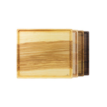 Load image into Gallery viewer, Set of stacked, handmade cutting boards on display, varying in wood species.