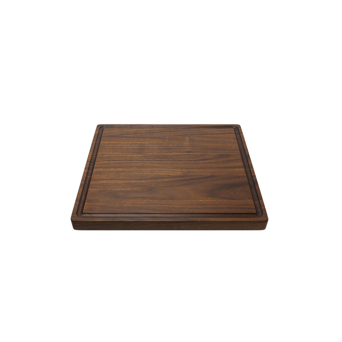 Medium sized handmade cutting board, in walnut, hand finished, with a juice channel feature. Made in the USA.