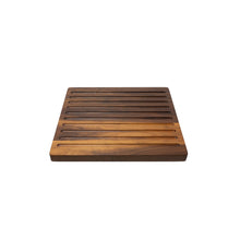 Load image into Gallery viewer, Medium sized handmade cutting board, in walnut, hand finished, with a carved, long recessed channels feature for breads. Made in the USA.
