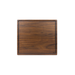 Medium sized handmade cutting board, in walnut, hand finished, with a juice channel feature. Made in the USA.