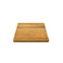 Load image into Gallery viewer, Medium sized handmade cutting board, in white oak, hand finished, with a carved, recessed face feature for juicy foods. Made in the USA.
