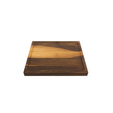 Load image into Gallery viewer, Medium sized handmade cutting board, in walnut, hand finished, with a carved, recessed face feature for juicy foods. Made in the USA.
