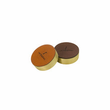 Load image into Gallery viewer, Modern brass paper weight with engraved leather.
