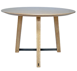Modern round dining table. Handmade in the us. With a tapered pedestal legs with blackened steel supports.